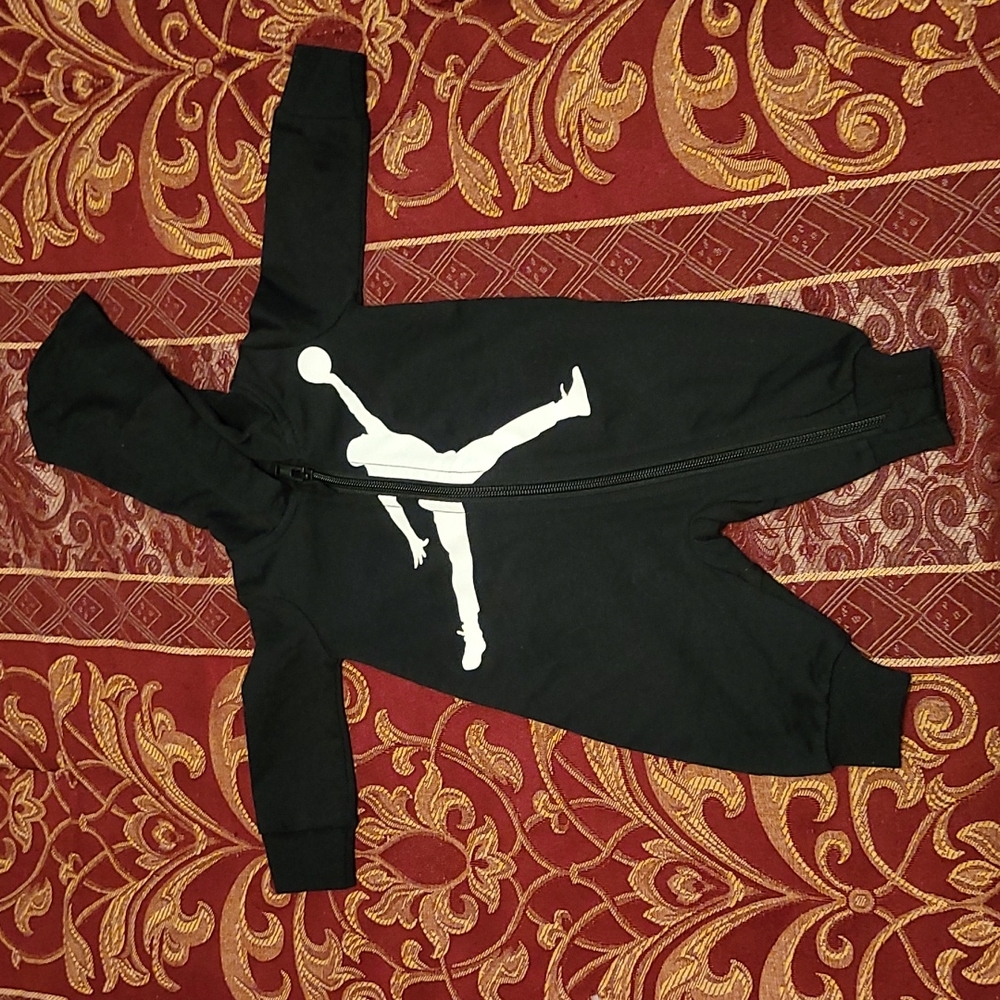Two newborn Jordan/Nike onesies